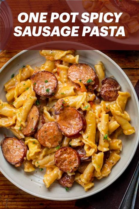 One Pot Spicy Sausage Pasta is pan-seared andouille smoked sausage, campanelle pasta, and a creamy, cheesy, spicy sauce. Smoked Sausage Recipes Pasta, Italian Sausage Recipes Pasta, Spicy Pasta Recipes, Andouille Sausage Recipes, Campanelle Pasta, Bologna Recipes, Creamy Sausage Pasta, Sausage Pasta Recipe, Spicy Sausage Pasta