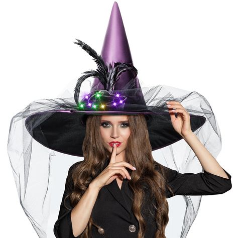 PRICES MAY VARY. Exquisite Design: with a high pointed, wide brim, light up flower, fluffy feathers, and stunning veil, this Halloween witch hat adds a touch of elegance to your Halloween costume and makes you stand out at any event or party Reliable Material: made of quality satin material, this purple witch hat is soft and smooth, skin friendly and comfortable to wear; The sturdy design ensures that it can maintain its shape for a long time Proper Size to Wear: this witches hat comes in one si Witches Costumes For Women, Witch Hat Halloween, Witch Costumes, Wizard Hat, Hat Light, Witch Hats, Witch Halloween Costume, Halloween Witch Hat, Hat Decoration