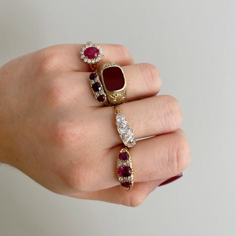 From our estate & antique collection, this ring features an oval ruby center surrounded by round brilliant diamonds, prong set in a 14K yellow gold mounting. Total ruby weight: 1.29 ct Total diamond weight: 0.49 ct Shape: Round Brilliant Color: K Clarity: I1 Ring Size: 4.75 This is a special piece of jewelry from our estate collection. We hope you will enjoy the character and imperfections that are associated with a vintage item. Antique Ruby Ring, Ruby Ring Gold, Vintage Gold Rings, Fancy Jewellery Designs, Garnet Jewelry, Garnet Earrings, Jewelry Lookbook, Ruby Diamond, Yellow Gold Ring