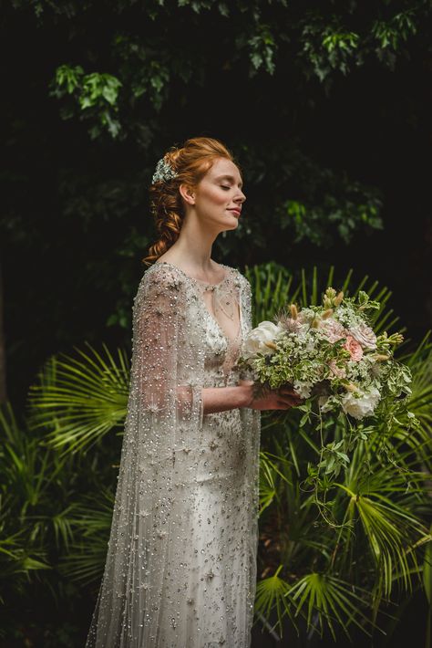 Wild + Natural Midsummer Nights Dream Inspired Bridal Elegance, with a Jenny Packham Celestial Cape | Love My Dress®, UK Wedding Blog, Podcast, Directory & Shop Celestial White Dress, Not Basic Wedding Dresses, Whimsical Bridal Dress, Trumpet Dress With Sleeves, Wedding Dresses Celestial, Forest Vibe Wedding Dress, Not Traditional Wedding Dress, Forest Wedding Gown, Wedding Dress Green Embroidery