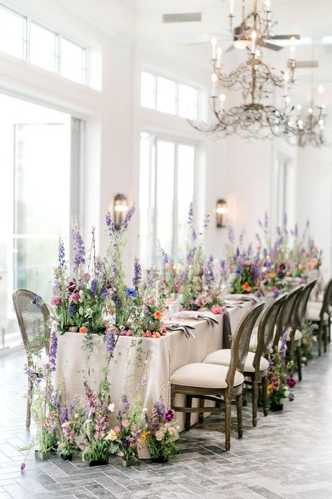 This intimate terrace wedding inspiration is resplendent in freeform flower ideas from natural, wild and overgrown ceremony backdrops to oversized bridal bouquets. With a peach, periwinkle and cream palette, this floral inspired decor offers the perfect blueprint for a spring or early summer soiree! Fairytale Floral Arrangements, Periwinkle Wedding Theme, Wedding Flower Backdrop, Periwinkle Wedding, Spring Wedding Decor, Wedding Flowers Decoration, Floral Wedding Decor, Wedding Decor Floral, Terrace Wedding