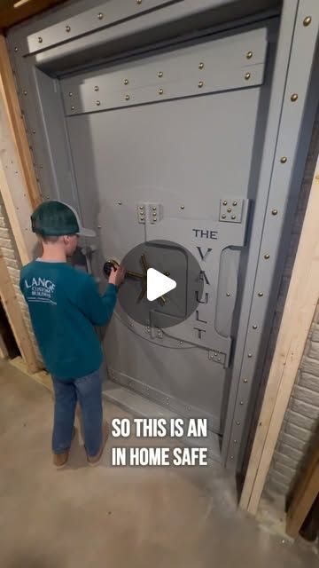 Lange Custom Builders - NW Ohio General Contractor on Instagram: "Check out this VAULT DOOR! This is an in home safe that we have added to this build. The room is encapsulated in concrete and secured with this @smithsecuritysafes beautiful safe door. We will be sharing more details about this but it is installed and looking great! #safe #safedoor #vault #vaultdoor #construction #newbuild #build #newhome #concrete" Vault Room Ideas, Secure House Design, Home Armory Ideas, Secret Safe Ideas, Safe Rooms In Houses, Tactical Room Ideas, Furnace Room Ideas, Hidden Pantry Floor Plan, Safe Room Ideas