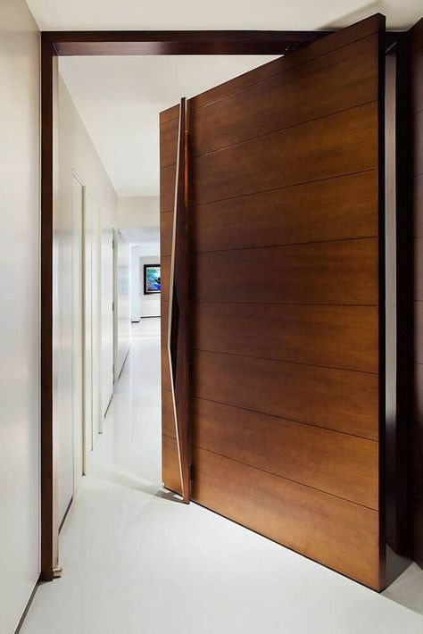 A large pivot door of an apartment in an #indian home. #indianhome #entryway #designideas #interiordesign #decorideas Tor Design, House Main Door, Modern Entrance Door, Modern Exterior Doors, Single Door Design, House Main Door Design, Main Entrance Door Design, Front Door Design Wood, Pivot Door