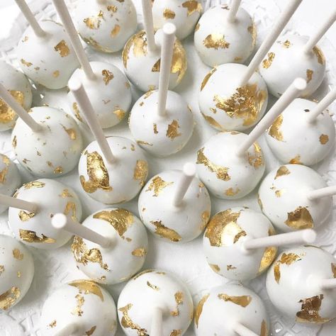 Obsessed with these 24k edible gold leaf cake pops for an intimate wedding✨ . . . #carlipenelopeevents #cakepops #customdesserts #dessert #eventplanner #njwedding #bride #bridetobe #njbaker #wedding #theknot #goldleaf #24kgold #oreotruffle #desserttable #eventstylist Wedding Cake And Cake Pops, Wedding Cake Pops Ideas, White And Gold Cake Pops, Gold Leaf Cake, Yellow Cake Pops, Cake Pops Ideas, Gold Cake Pops, Elegant Cake Pops, Gold Dessert Table