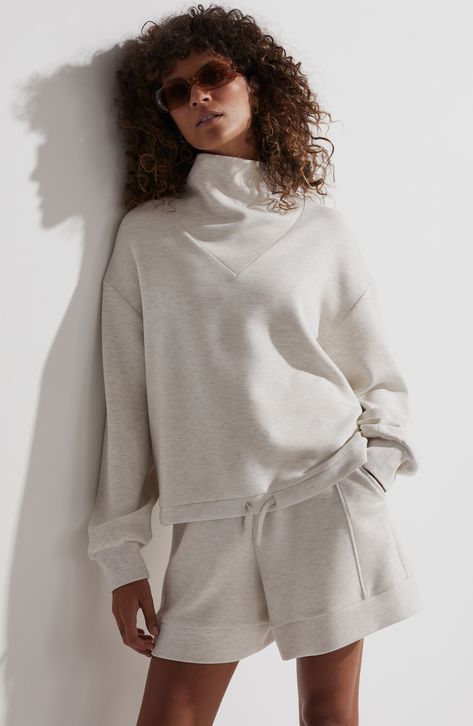 Muted tones and a softly shaped inset funnel neck add style points to this essential sweatshirt designed with a drawstring hem. 23" length (size Medium) Funnel neck Ribbed cuffs 72% viscose, 23% polyester, 5% elastane Machine wash, dry flat Imported Funnel Neck Sweatshirt, Turtleneck Sweatshirt, Sweatshirt Outfit, Funnel Neck, Funnel, Nordstrom