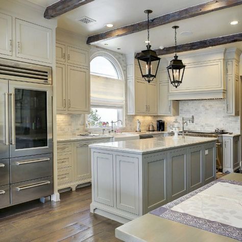 Sophisticated white and light grey French country kitchen with lantern pendants over island in a Houston home by Thomas O'Neill. #frenchcountry #kitchendesign #whitekitchen #traditionalkitchen French Kitchen Lighting, French Renovation, Classic French Kitchen, French Country Mansion, Modern French Country Kitchen, French Kitchen Design, French Country Rug, French Country Chandelier, Country Mansion