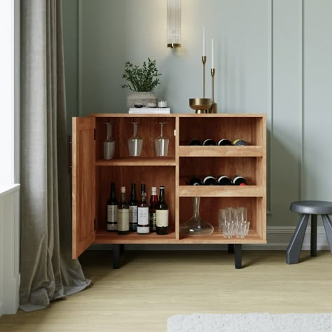 Highly practical, but far from boring, the classic style of this bar and sideboard cabinet is a showstopper that looks great in any space. Your shot glasses and brandy snifters can be stored inside the cabinet that boasts a Shaker style door and adjustable shelf while the hanging stemware holders keep your wineglasses within easy reach. Decanters of your best spirits can reside on the water resistant surface and bottles of your favorite wine will rest on the slanted open bottle shelves. Comprise Closed Bar Cabinet, Long Bar Cart, Small Tea Bar Ideas, Boho Bar Cabinet, Mini Bar At Home Living Rooms, Bar Cart With Mini Fridge, Drink Cabinet Ideas, Home Bar Styling, Buffet Cabinet Diy