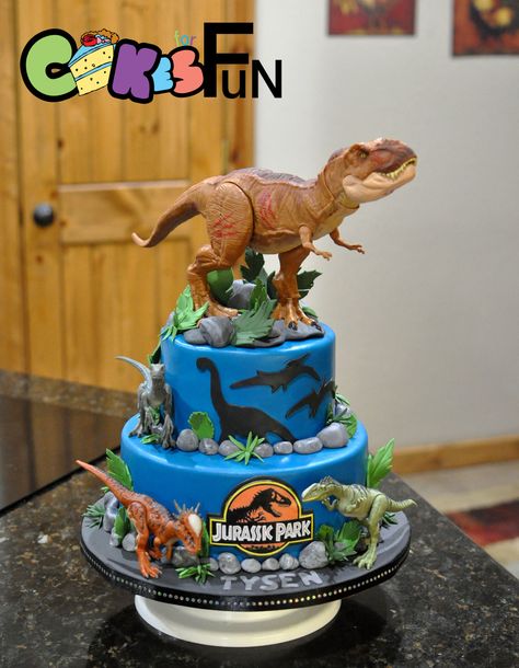 I don’t do anything special. I just do what is ordered. Customer sent toy dinosaurs, I made cake. That one on top was so huge. I hope he makes it to his destination without falling off. I made a fondant base for his feet and glued him in there... Fête Jurassic Park, Jurassic Park Cake, Jurassic World Cake, Dinasour Birthday, Dino Birthday Cake, Festa Jurassic Park, Jurassic Park Birthday Party, Jurassic Park Party, Dinosaur Birthday Theme