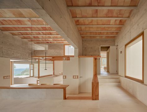 Image 1 of 41 from gallery of House in Puntiró / RipollTizon. Photograph by José Hevia Square Floor Plans, Load Bearing Wall, Multipurpose Room, Island House, Patio Interior, Natural Ventilation, Mediterranean Homes, House Kitchen, House On A Hill