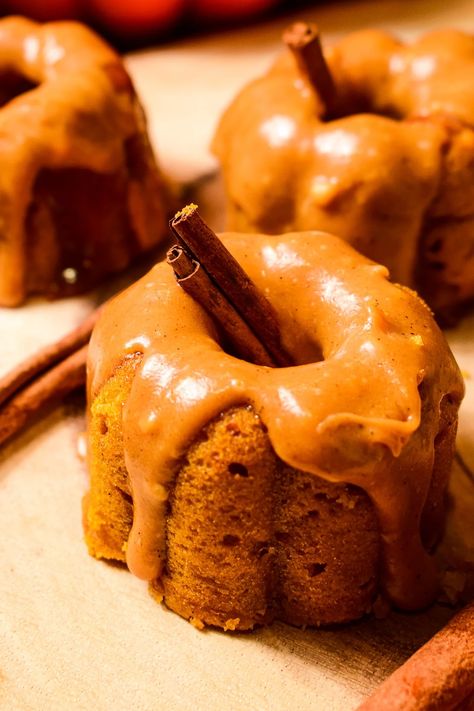 MINI PUMPKIN SPICE BUNDT CAKES WITH SALTED CARAMEL ICING Salted Caramel Icing, Salted Carmel, Caramel Icing, Pumpkin Bundt Cake, Mini Bundt, Thanksgiving 2024, Mini Bundt Cakes, Fall Cakes, Bundt Cakes