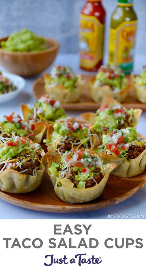 Easy Taco Salad Cups on a wood serving plate with hot sauce and guacamole in the background. Easy Bitesize Appetizers, Teenage Appetizers Parties Food, Food Table For Party, Mini Foods For Party Bite Size, Taco Salad Cups, Salad Cups, Appetizer Salad, Taco Cups, Mexican Appetizers