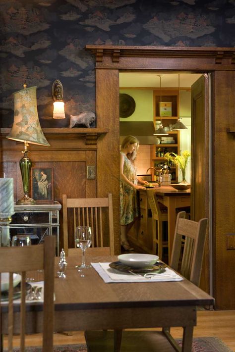 In the dining room, quarter-sawn oak woodwork was never altered; Michelle works at the kitchen’s center island beyond Craftsman Bungalow Interior, Craftsman Style Interiors, Kitchen Restoration, Craftsman Dining Room, Craftsman Interiors, Room Crafts, Mission Style Homes, Bungalow Interiors, Arts And Crafts Interiors