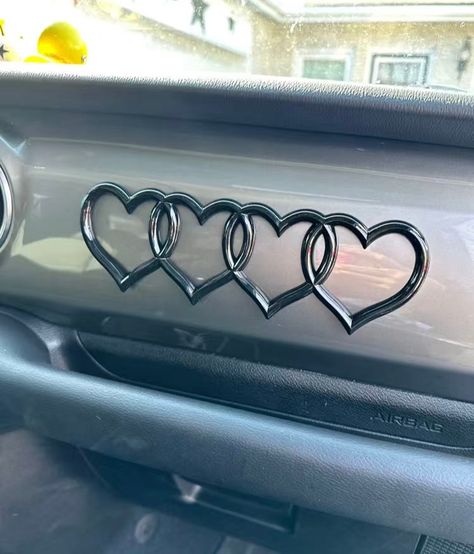 Super cute and fun heart car logo / emblem for your car exterior (or interior if you want!) Made out of lightweight plastic. All you have to do is peel of the lining on the back to reveal the sticky part and stick it wherever you want! Comes in pink, silver, white or black! About 8 1/2 x 2 1/2 inches. Perfect mod for your car. tags, modification, aesthetic, y2k, cute, girly, fun, bumper sticker, decal, 2000s, car, accessories, mirror, bumper, mods, heart, hearts, car logo, auto logo, decor, decoration, locker, wall Pink Car Interior, Pink Car Accessories, Cars Interior, Logo Heart, Girly Car Accessories, Car Deco, Car Modification, Girl Car, Cool Car Accessories