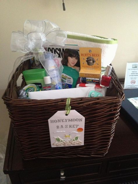 Honeymoon Basket   Send the happy couple on their way with a basket full of stuff for their honeymoon.This basket includes: Colgate Wisps, A Bottle of Advil Tablets, A First Aid Kit, Nail Enamel, Purell Sanitzer, A Big Pack of Spearmint Gum,  A Bottle of Listerine, A Bottle of Aloe Vera Gel, Clorox Wipes, Coppertone Sun Tan Lotion, Puzzle Book, Lip Balm, 2 Bath Towels.   This Honeymoon Basket packed with essentials sells for $60.00 Wedding Toiletries Basket, Honeymoon Survival Kit, Honey Moon Gift Basket, Wedding Bathroom Care Basket, Honeymoon Baskets For Bride And Groom, Honeymoon Basket, Spearmint Gum, Clorox Wipes, Holiday Gift Baskets