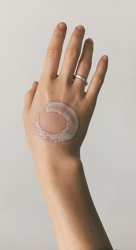 White Ink Wave Tattoo, White Ink Finger Tattoo Healed, White Ink Word Tattoo, Small White Ink Tattoo For Women, White Ink Hand Tattoos For Women, White And Pink Tattoo, White Ink Wrist Tattoo, White Ink Heart Tattoo, White Ink Ring Tattoo