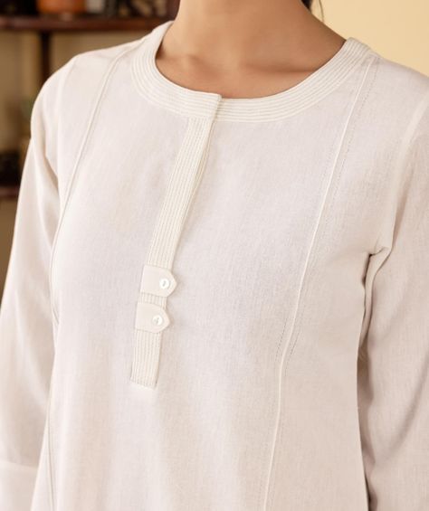 ~BASICS~ Everyday Essentials - New Arrivals! This flax kurta in white is comfortable and sophisticated. A beautifully couched neck and front band ends in a detailing of tabs and buttons. Lace detailing on the sleeves is understated and elegant. [ Cottons Jaipur, Cotton, Basics, Everyday, Essentials, New Arrivlas] #cottons #cottonsjaipur #newarrivals #basics #everday #essentials #dailyfits #confort #cottonkurtas #breathablefabric #handcrated #solidkurtas #solid #monochrome #cottonsuits #d... Kurta Sleeves Pattern, Front Neck Designs, Cottons Jaipur, Kurta Ideas, Suit Neck Designs, Suit Neck, Indian Kurtis, Summer 25, Designer Kurti Patterns