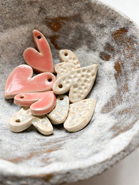 Photo of red and white ceramic pendants Ceramic Heart Pendant, Heart Pottery Ideas, Ceramic Hearts, Pottery Heart, Heart Ceramic, Clay Hearts, Ceramic Mobile, Ceramic Heart, Heart Pottery