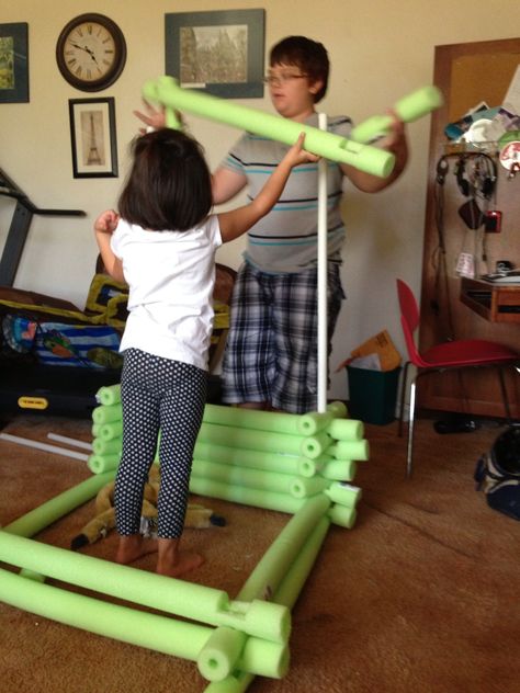 So pleased with how the pool noodle "Legos" turned out.  We used the poles so the kids could drape a sheet for the roof.  We do need more noodles though. Here we used 20 noodles from the Dollar store. I didn't measure anything just eye balled. Probably the would turn out better if you are more consistent with the cuts!   Have fun! Pool Noodle Lincoln Logs, Noodles Ideas, Pool Noodle Crafts, Lincoln Logs, Pool Noodle, Pool Noodles, Front Porch Ideas, Kids Corner, Kids Videos