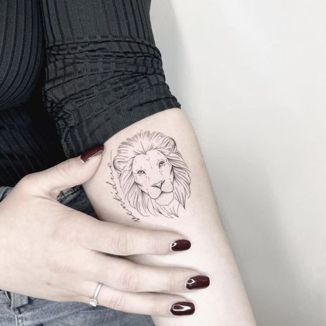 Best Lion Tattoo Forearm Designs For Women - Inspired Beauty Christian Lion Tattoo For Women, Lion Tattoo Forearm, Minimalist Lion Tattoo, Lion Eyes Tattoo, Simple Lion Tattoo, Bicep Tattoo Women, Lion Tattoo Meaning, Lion Forearm Tattoos, Tattoo Mom