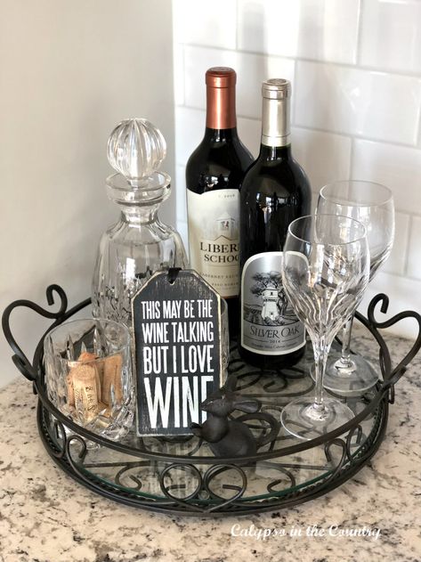 Glass tray with wine bottles and glasses Wine Theme Dining Room Decor, Kitchen Counter Wine Decor Ideas, Wine Vignette Ideas, Wine Tray Ideas Decor, Bar Tray Styling Decorative Trays, Liquor Tray Display Ideas, Wine Tray Ideas, Wine Glass Display Ideas, Bar Tray Ideas