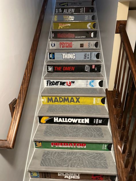 We went from dirty carpet to these beautiful VHS movie inspired stairs. Staircase Paint, Stairs Painted, Basement Stair, Painted Staircases, Stair Makeover, Theatre Inspiration, Store Room, Basement Stairs, Video Store