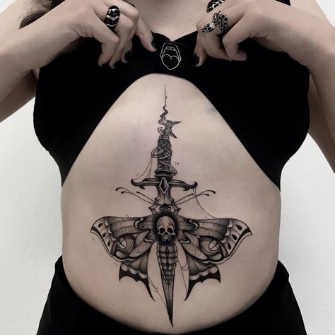 15+ Dagger Tattoos That Will Set Your Heart Aflutter - 100 Tattoos Sternum Heart Tattoo Women, Dagger Sternum Tattoo Women, Sternum Tattoo Women Small, Dagger Back Tattoo, Dagger Chest Tattoo Female, Dagger Chest Tattoo, Dagger Sternum Tattoo, Heart And Dagger Tattoo, Sternum Tattoo Women