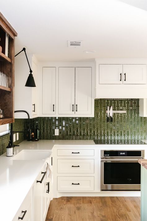 This modern farmhouse kitchen at our Summer Lane project was transformed by this high-gloss green subway tile. The pop of color in the backsplash is such a beautiful contrast to the white cabinets, warm wood open shelving, and black cabinet hardware! Wood Open Shelving, Green Kitchen Backsplash, Backsplash With White Cabinets, Green Subway Tile, Calm Nature, Green Backsplash, Black Cabinet Hardware, Green Tile, Kitchen Tile