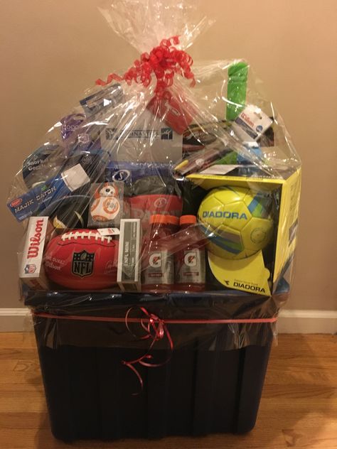 Sports Theme Basket for school fundraiser! Soccer, Basketball, football, Velcro catch game, t-ball set, water bottles, frisbee, ball pump, sports store gift cards and donations from gymnastics! Sports Auction Basket Ideas, Raffle Gift Basket Ideas, Tricky Tray, Silent Auction Basket, Auction Gift Basket Ideas, Fundraiser Baskets, Theme Baskets, Silent Auction Baskets, Auction Basket