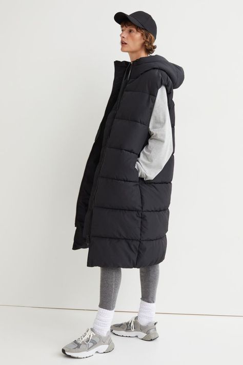 Hooded puffer gilet - Black - Ladies | H&M 1 Long Puffer Vest Outfit, Long Puffer Vest, Puffer Vest Outfit, Hooded Puffer Vest, Puffer Gilet, Short Puffer Jacket, Cotton Jersey Dress, Long Puffer, Boucle Jacket