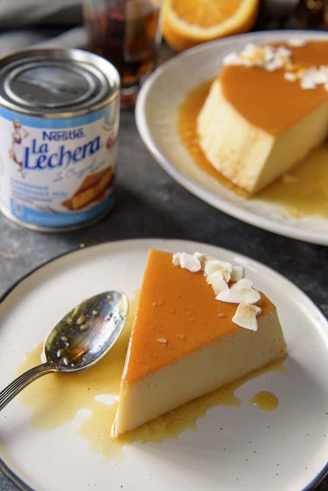 You don't have to be on a tropical vacation to enjoy a slice of this silky-smooth Orange Coconut Flan - it's just as easy to make at home! A tasty variation on the classic, this flan de coco combines a creamy coconut custard with an orange-rum caramel crown. #crumbykitchen #flan #flandecoco #coconutflan #hispanic #dessertrecipes Portuguese Flan Recipe, Coconut Pastries, Coconut Milk Flan, Coconut Flan Recipe, Flan Recipes, Rum Caramel, Pumpkin Flan, Coconut Flan, Portuguese Sweet Bread