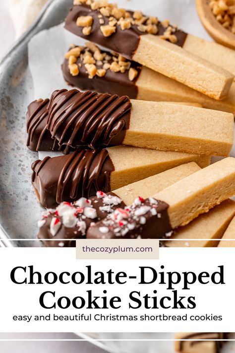 These easy cookie sticks have a tender shortbread base with a snap that’s satisfying to bite into and are dipped in your favorite chocolate and decorated with festive sprinkles, nuts, or candies. If you’re looking for a crisp, buttery cookie for your Christmas cookie box that’s both eye-catching and delicious, these aesthetic Christmas shortbread cookies are just what you need! Christmas Sprinkles Cookies, Easy Christmas Shortbread Cookies, Turtle Shortbread Cookies, Shortbread Stick Cookies, Pretzel Shortbread Cookies, Cookie Sticks Decorated Christmas, Chocolate Spritz Cookie Recipe, Orange Shortbread Cookie Sticks, Cutout Shortbread Cookies