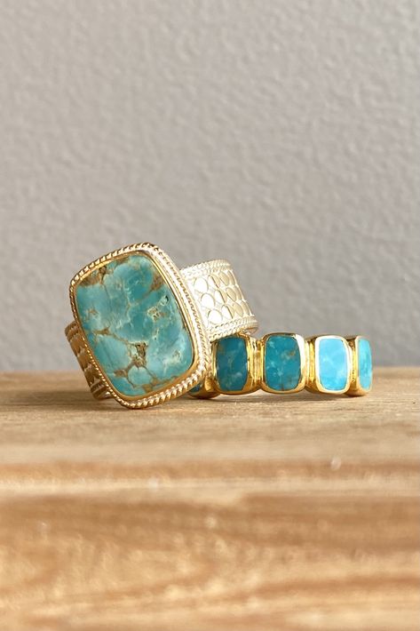 Gold Turquoise Stacking Rings and Layering Necklaces - Koehn & Koehn Jewelers - Brand new to our cases is the Anna Beck Spring and Summer Turquoise Collection! From stunning rings to fun pendants, this collection has it all. Anna Beck focused on cushion cut turquoise to create a bold bohemian jewelry style. The Cushion Turquoise Cocktail Ring and Multi-Stone Stacking Ring pair perfectly together. Follow the link to shop the Anna Beck Designs Jewelry Collection on our website. Multi Stone Necklace, Turquoise Jewelry Outfit, Turquoise Cocktail, Sand Design, Anna Beck Jewelry, Spring Jewelry Trends, Stunning Rings, Turquoise Jewelry Necklace, Bold Bohemian