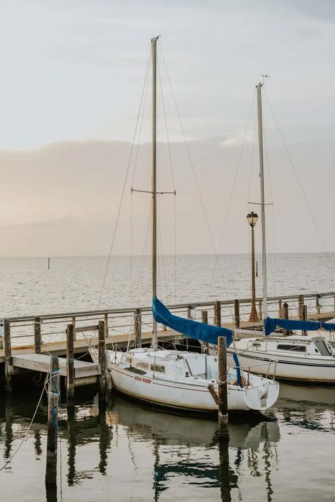 Fairhope is a delightful seaside resort situated on the picturesque shoreline of Mobile Bay. It offers a wide range of dining options, nature preserves, and numerous activities to explore during weekend or weeklong getaways with friends. Here's our ultimate girls' getaway guide to Fairhope, Alabama with all the tips you need to plan an unforgettable girls' trip! Boat On Sea, Fairhope Alabama, Blue Boat, Local Brewery, Girls Getaway, Morning Dew, Seaside Resort, Nature Preserve, Boat Dock