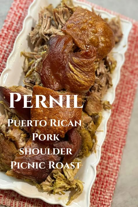 Beyond being an iconic Christmas dish, pernil (bone-in pork shoulder picnic roast) is also a popular item at parties, events, and weddings or forms part of the regular Puerto Rican household menu. In addition to its fall-off-the-bone, juicy, tender meat, pernil has a unique characteristic: The Cuerito. The pork skin, or cuerito's toasty top, which we test with a knife or cleaver, has a crisp exterior with a crunch that is music to the ears! Spanish Pork Shoulder, Pork Shoulder Picnic Roast, Puerto Rican Pernil, Pork Shoulder Picnic, Spanish Pork, Pork Picnic, Picnic Roast, Spanish Dinner, Pork Skin