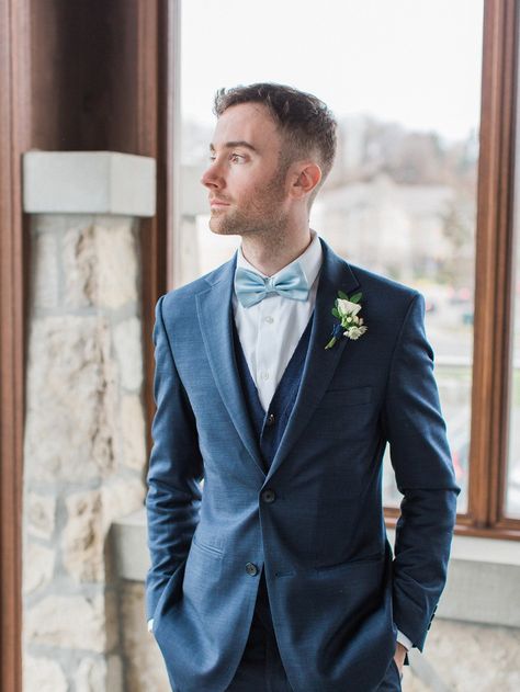 groom in navy blue suite and soft blue bow tie Blue Suit With Bow Tie Wedding, Blue Suit Bow Tie, Teal Bow Tie, Blue Groomsmen, Navy Groom, Blue Tux, Navy Suit Wedding, Groomsmen Style, November Ideas