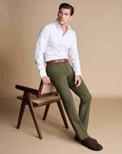 Twill 5 Pocket Jeans - Stone | Charles Tyrwhitt White Shirt Green Pants Men, Olive Jeans Outfit Men, Army Green Outfit Men, Olive Green Pants Outfit Men Casual, Olive Green Chinos Outfit Men, Green Pants Men Outfit, Mens Green Pants Outfit, How To Style Olive Green Pants, Brown And Green Outfits Men