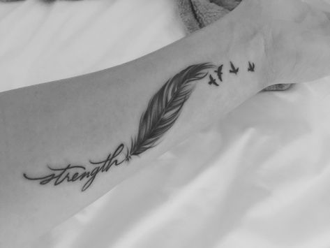 Wrist tattoo strength, feather, 4 birds Feather Word Tattoo, Breathe Feather Tattoo, Feather With Words Tattoo, Just Breathe Feather Tattoo, Feather And Birds Tattoo Ideas, Feather Wrist Tattoo, Plumas Tattoo, Traveling Tattoos, Feather Tattoo Wrist