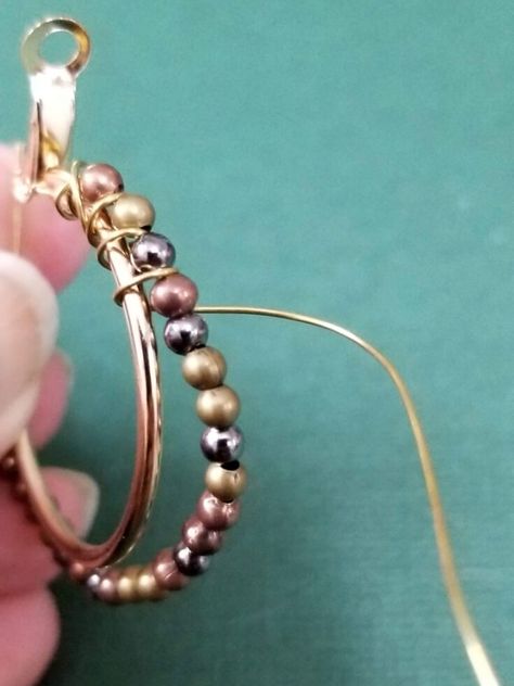 How to wire wrap hoop earrings * Moms and Crafters Diy Earrings Hoops Wire Jewelry, Handmade Hoop Earrings Ideas, Wire Bead Earrings Tutorial, Diy Beaded Hoop Earrings, Wire And Bead Earrings, Hoop Earring Ideas, How To Make Beaded Earrings, Handmade Wire Earrings, Hoop Earrings Diy