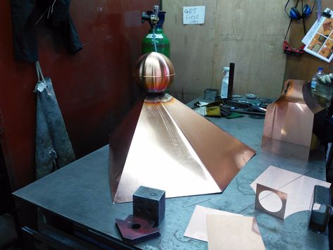 Bespoke copper finial with skirt for a customers summerhouse.  Finials can be produced to virtually any design in Copper, Stainless Steel and GRP.  https://www.clockscupolasandweathervanes.co.uk/bespoke-metal-finials  #coppersmiths #copperfinial #decorativerooffinial Chimney Design Ideas, Spanish House Exterior, Wood Stove Chimney, Fireplace Vent, Chimney Caps, Metal Shingles, Chimney Design, Chimney Cleaning, Chimney Cap