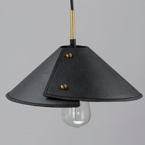 Expertly stitched leather shades are bound by brass finials in a folded shape that is radially asymmetric. These black leather shades obstruct LED lamping to create ambient indirect lighting and pair well with the Naturally Aged Brass frames that feature a smooth, chestnut leather wrap detail. The shades on the expansive two-light pendant are adjustable to provide function on its oversized width perfectly chic over a dining table, bar, or kitchen island. The wall sconce option is designed for bo Lamp On The Wall, Leather Lamp Shade, Leather Table Lamp, Leather Pendant Light, Leather Lamps, Leather Lighting, Leather Chandelier, Leather Lamp, Leather Working Projects