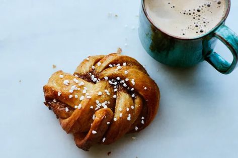 Cardamom Knots recipe | Epicurious.com Cardamom Knots, Morning Bun, Cardamom Buns, Breakfast Treats, Baking Sheets, Dry Yeast, Cinnamon Rolls, Tray Bakes, Baked Goods