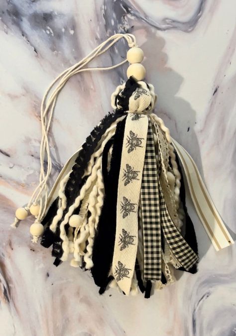 Handcrafted Bible tassel/bookmark. Inpired by Psalm 119:123 "Your Word is sweeter than honey. Black and Ivory featuring honey bee ribbon with lace, beautifully textured ribbons, textured yarns, Pom pom ribbon, etc. This one is upgraded and has 3 bookmark strands to mark up to 3 places in your Bible! Each tassel is one of a kind! Book Accessories Diy, Bookmark Tassel Diy, Bible Tassel Bookmark Diy, Bible Tassel, Bible Accessories, Keychain Crafts, Bible Bookmarks, Sweeter Than Honey, Celebrate Recovery