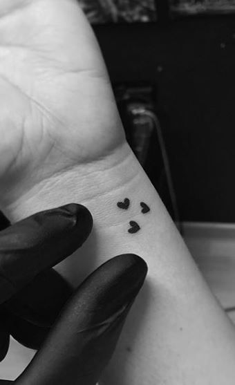 4 Small Heart Tattoo On Wrist, Wrist Micro Tattoo, Small Heart Hand Tattoos For Women, Tiny Tattoos For Daughter, Cute Tattoos For Husband, Micro Hearts Tattoo, A Tattoo For My Husband, Four Small Hearts Tattoo, Connected Initial Tattoos