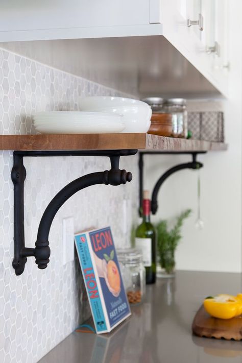 If you feel strongly about keeping all of your most-frequently-used items out and visible (instead of stashed behind cabinet doors) but don't have counter space to waste, add a level of shelves on your backsplash to store those items. See more at The House Diaries »  - GoodHousekeeping.com Backsplash Shelves, Backsplash Shelf, Kitchen Counter Shelf, Staggered Shelves, Sink Window, Counter Storage, Counter Ideas, Style Shelves, Before After Kitchen