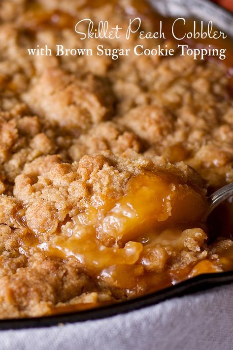 Summer peach cobbler with brown sugar cookie topping, cooked in a cast iron skillet. Peach Cobbler With Cookie Dough Topping, Peach Crisp In Cast Iron Skillet, Cast Iron Skillet Peach Cobbler Recipe, Skillet Peach Crisp, Peach Cast Iron Dessert, Cast Iron Peach Crisp, Peach Cobbler Skillet Recipe, Peach Cobbler In Cast Iron Skillet, Stovetop Peach Cobbler