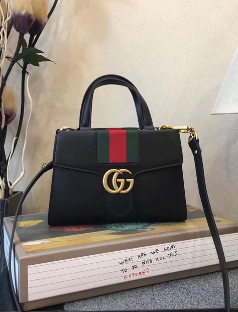 The interior of the Gucci GG Marmont Sylvie Small Web Tote Black is more than just practical. It has large compartments, pockets and overall place for smartphone, keys and etc. In addition, there are side pockets as well, which are rare on these bags. Ladies Purses Handbags Style, Side Purse, Classy Purses, Fancy Purses, Side Purses, Casual Purse, Bags For Sale, Ladies Bag, Stylish Purse