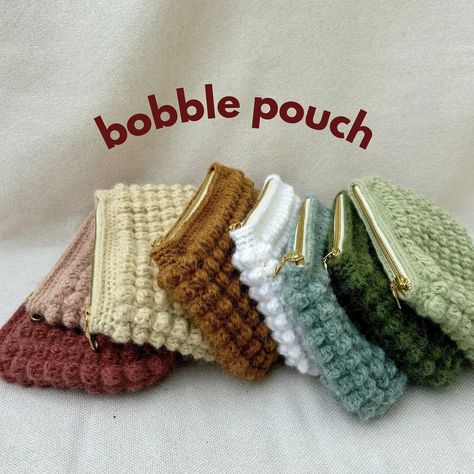 introducing the bobble pouch✨ these are perfect makeup bags or pencil pouches! They are going to be available on my etsy store in 8 different colors and lined with floral fabrics. Check them out in just 3 days!!! . . . #bobble #bobblestitch #smallbusiness #smallbusinessowner #bobblepouch #makeupbag #makeupbags #pencilpouch #pencilpouches #crochet #crochetlove #crochetaddict #etsy #etsyshop #etsyseller Crochet Bobble Pouch, Crochet Pouch With Zipper, Crochet Toiletry Bag, Crochet Makeup Pouch, Crochet Hook Pouch, Makeup Bag Crochet, Crochet Pencil Pouch, Granny Square Pouch, Crochet Zipper Pouch