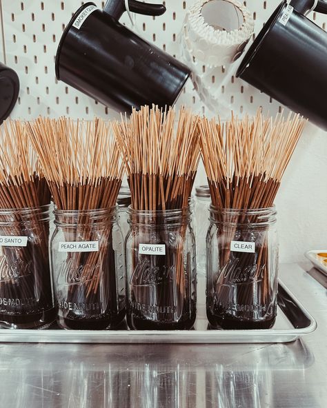 Our Incense comes in ALL 10 of our Crystal candle fragrances plus our Palo Santo & Sage too. People always ask me who makes my products and I tell them you’re looking at her. Just like our candles, I hand-make incense in small batches right in store. That’s probably also why I always hear, “it smells so good in here”. ✨ #vibescandles #crystalcandles #homefragranceproducts #incense #incenseburner #incensesticks #incensestick #incensemaking #incenselover #incenseshop #visitma #massachusetts #m... Incense Store, Market Stall, Candle Store, Market Stalls, Crystal Candle, Crystal Candles, Incense Sticks, Incense Burner, Small Batches