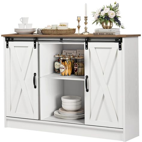 PRICES MAY VARY. 【Farmhouse Coffee Bar】:The farmhouse coffee bar with storage complements your dining room. The 2 open storage spaces in the middle with sliding doors designed with black metal strips are both beautiful and convenient. It makes the white coffee bar cabinet with storage overall elegant and luxurious. 【Sliding Barn Door Design】: Compared with the traditional coffee bar cabinet with doors, this white coffee bar cabinet is designed with elegant and chic looking sliding barn doors, su White Buffet Cabinet, Farmhouse Buffet Cabinet, White Sideboard Buffet, Luxury Kitchen Cabinets, Coffee Bar Cabinet, Farmhouse Buffet, White Buffet, Farmhouse Coffee Bar, Dining Room Cabinet