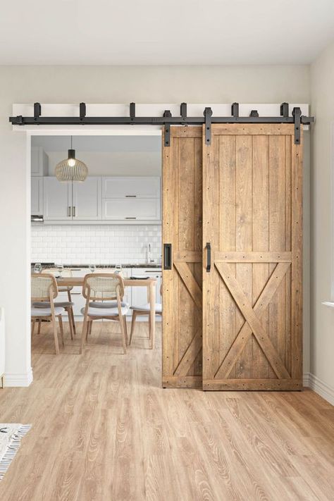 Barn Doors are the newest sensation to make your home stand out and wow any guests! Check out all of our barn doors to bring a rustic and modern vibe that your home deserves 🏡🤩 Visit: https://rusticrollingdoors.com/ Sliding Door In Dining Room, Barn House Door, Homes With Barn Doors, One Barn Door For Two Openings, Sliding Farmhouse Doors Interior, Barn Doors In House, Farm Sliding Door, Barn Bedroom Door, Double Barn Doors Sliding Bedroom